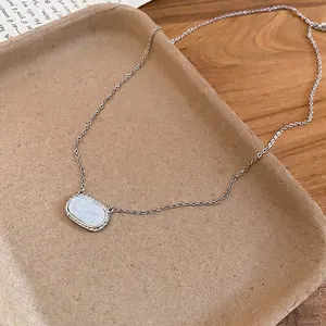 S925 silver necklace with an oval resin pendant and white zircon halo in a tray