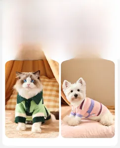 Detail of striped pet polo sweaters with buttons on a Ragdoll cat and Westie dog