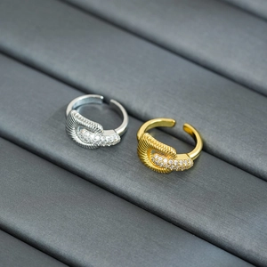 Detail of twisted gold and silver plated rings with sparkling micro-pave crystals