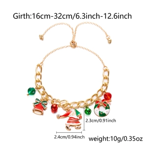 Detail of Christmas bracelet with Santa, bell and wreath charms on adjustable gold chain