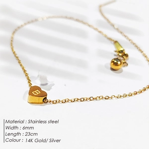 Close-up detail of a 14K gold-plated stainless steel heart anklet with letter B