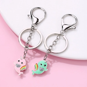Cute magnetic whale keychains for best friends with pink and green narwhal pendants