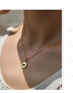 Detail view of a vintage s925 silver necklace with red crystal pendant on a model