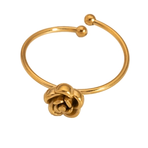 Detailed shot of a gold rose bangle with polished metallic finish and open-end design