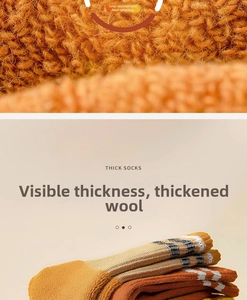 Close-up of thick knitted wool socks in warm orange showing texture and cozy striped patterns