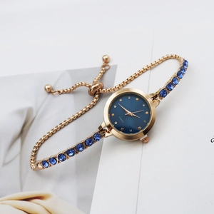 Elegant rose gold quartz watch with blue crystal bracelet and adjustable slide buckle