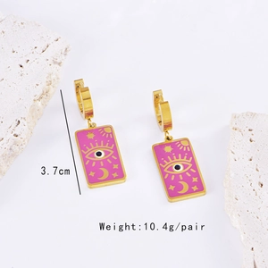 Detail of rose red enamel earrings with celestial eye motifs and measurement markers