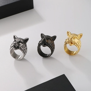 Detailed comparison of Viking wolf head rings in silver, black, and gold metal finishes