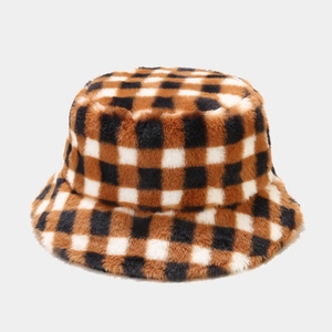 Detailed close-up of the thick brown and black checkered plush fabric of this winter hat