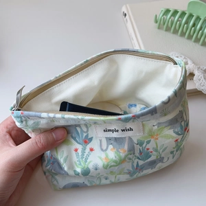 Floral canvas pouch with elephant print and zipper, ideal for makeup storage