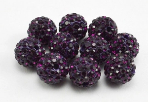 Detailed view of 10mm deep purple clay disco ball beads with micro pave crystals