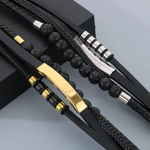 Macro view of multi-layer leather bracelets with stainless steel clasps and lava stones
