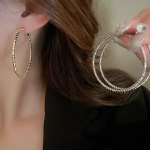 Minimalist gold and silver geometric hoop earrings with textured finish for women