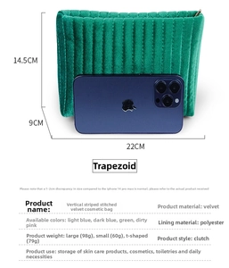 Detailed dimensions of green quilted velvet trapezoid cosmetic bag with phone size comparison