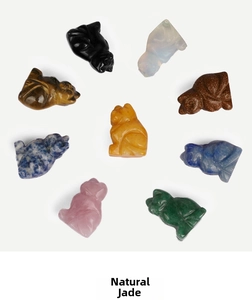 Macro shot of assorted natural semi-precious gemstone cat carvings in eight colors