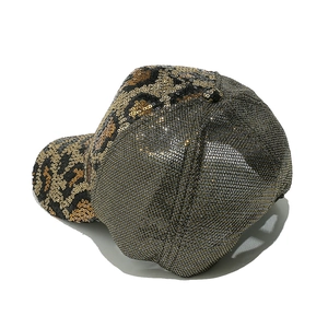 Detail view of leopard print sequin baseball cap showing mesh and animal pattern texture