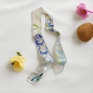 Detail of silk scarf featuring Van Gogh iris oil painting print on white background