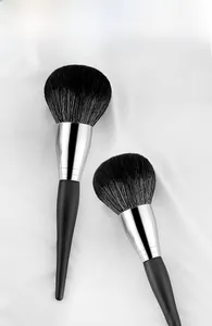 Detail of soft black bristles and copper ferrules on professional makeup brushes