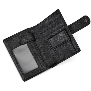Detail showing the inner layout of the leather wallet with card slots and a coin pocket