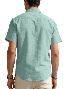 Detail view of men's short sleeve shirt in mint green with cotton linen texture