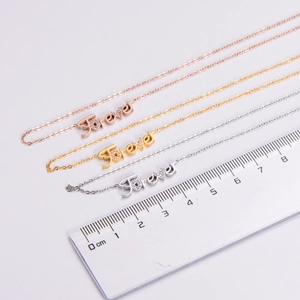 Three-color Forever letter necklace pendant measurement showing 3cm width on ruler