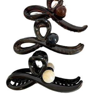 Elegant Maillard style crossover hair claws with decorative round beads in three colors
