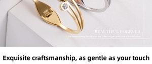 Detail of layered gold-plated titanium steel bracelet with sparkling zircon accents