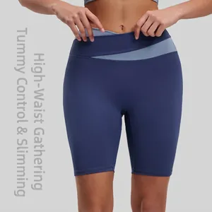 High-waisted color-block yoga shorts with elastic tummy control in navy and light blue
