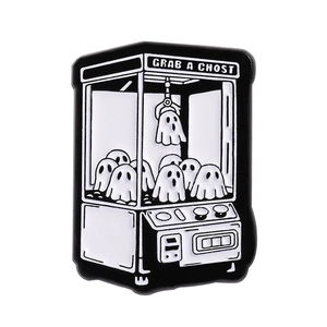Ghost claw machine enamel pin featuring Grab a Ghost text in black and white finish