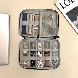 Gray fabric travel organizer bag for Apple Watch bands and charging cables with dual zippers