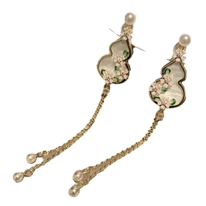 Floral gourd earrings with white pearls and long tassels in elegant gold finish