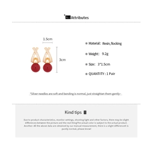 Detail showing dimensions and material of gold-plated red bead earrings with resin flocking