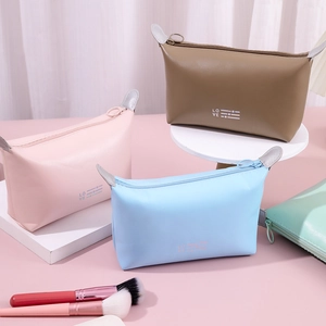 Chic PU leather travel cosmetic bags in pink, brown, and blue with 'LOVE' detail