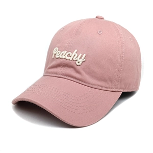 Close-up of pink cotton baseball cap with white 3D Peachy embroidery and curved brim
