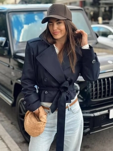 Navy blue double-breasted trench coat with belt and modern street style design