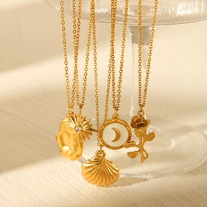 Set of five gold stainless steel necklaces with sun, moon, shell and rose pendants