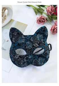Close-up of cat-ear mesh mask with blue and silver floral sequin embroidery details