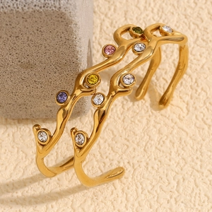 18K gold plated stainless steel branch bracelet with colorful zircon stones on grey stone