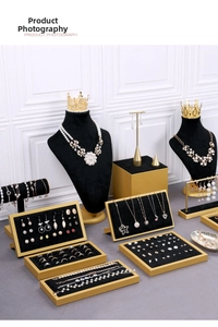 Luxurious black velvet jewelry display stand set with gold frames for necklaces and rings