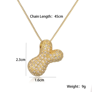 Detailed view of gold bone pendant necklace with dimensions 2.3x1.6cm and 45cm chain length