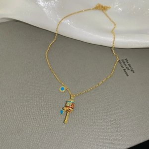 Detail of gold necklace with zircon hollow flower and colorful enamel pendant