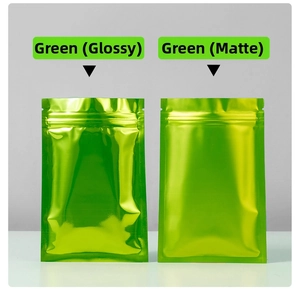 Detail comparing glossy and matte finishes of green metallic zip-top foil bags