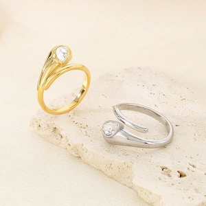 Adjustable stainless steel drop rings in gold and silver with pear-cut crystal accents