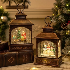 Vintage bronze Christmas lanterns with lighted Santa and Snowman holiday scenes