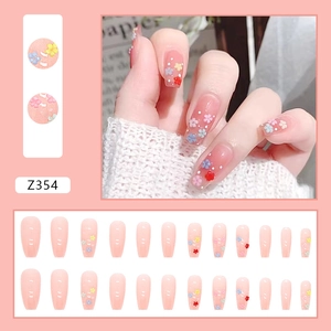 Long ballerina press-on nails with 3D colorful flowers and white polka dots on pink base