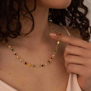 18K gold plated necklace with colorful square zircons worn by model on collarbone