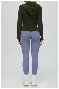 Slim-fit olive green fleece hoodie with lavender high-waist yoga pants and white socks