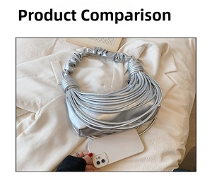 Silver pleated croissant bag with layered fringe and knot handle next to a smartphone