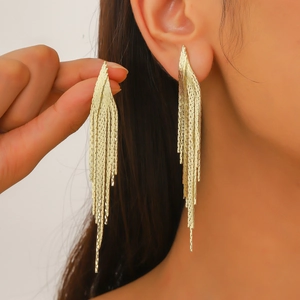 Elegant gold-tone long fringe tassel earrings featuring sparkling chain drop design