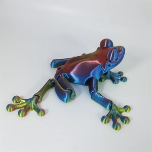 Detailed macro view of an articulated 3D printed frog toy with a rainbow gradient finish